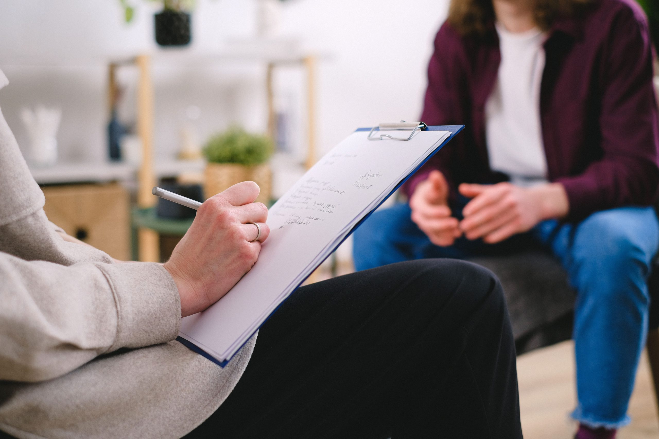 Psychiatrist conducting a psychiatric evaluation with an adult patient